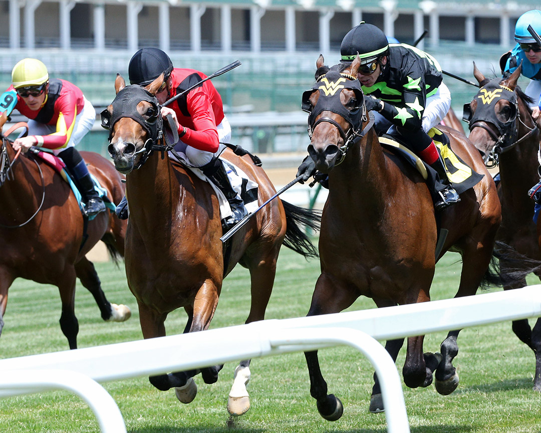 Overbore (right) finishes second to Artos in a Churchill Downs maiden race on May 21