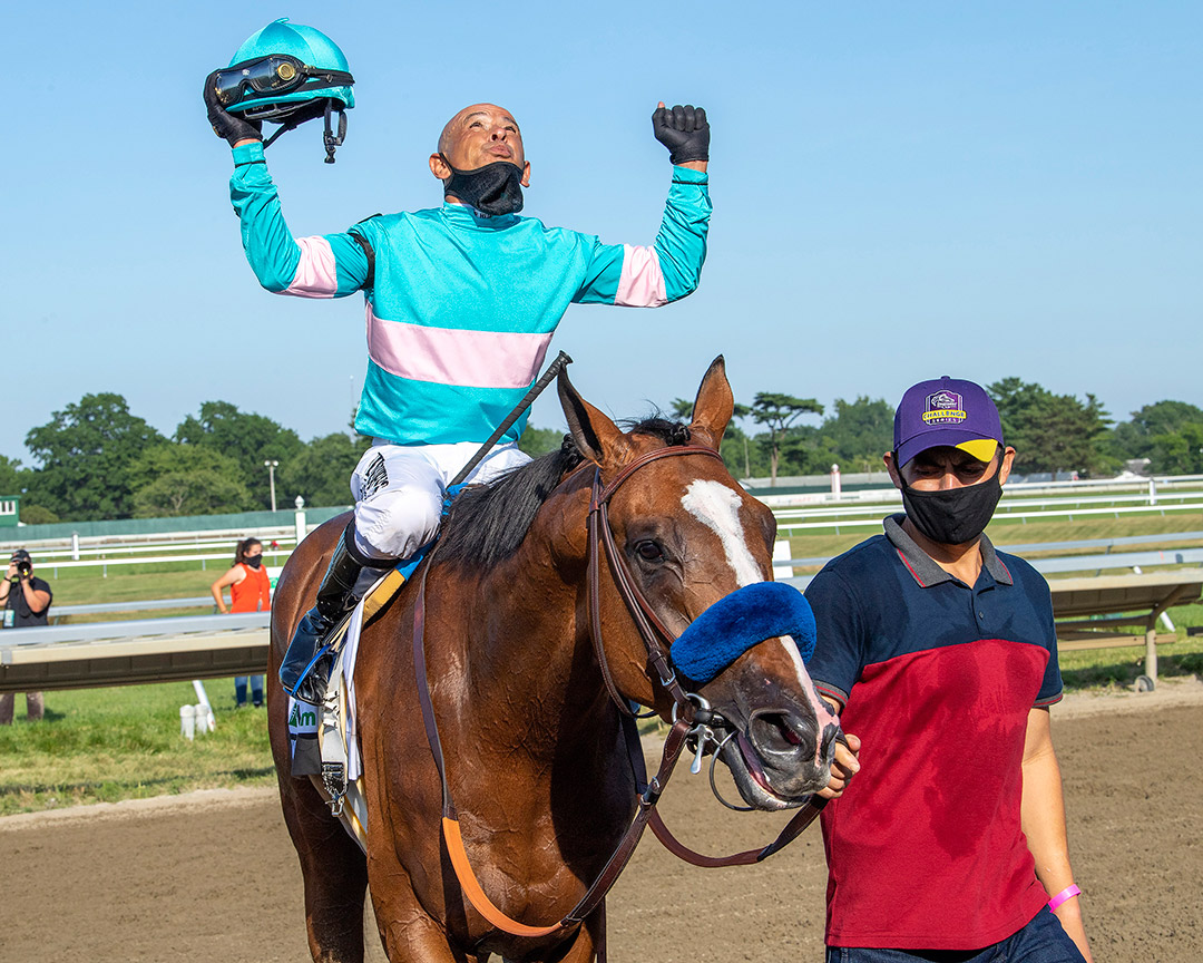 Mike Smith celebrates after winning the Haskell with Authentic