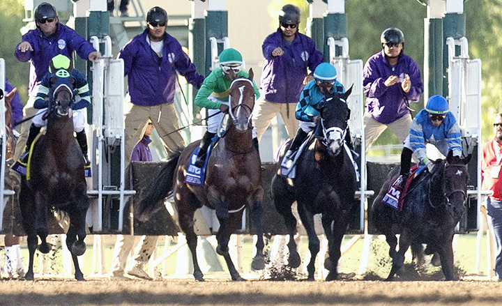 Dennis Moment (right) stumbles at the start of the Breeders Cup Juvenile