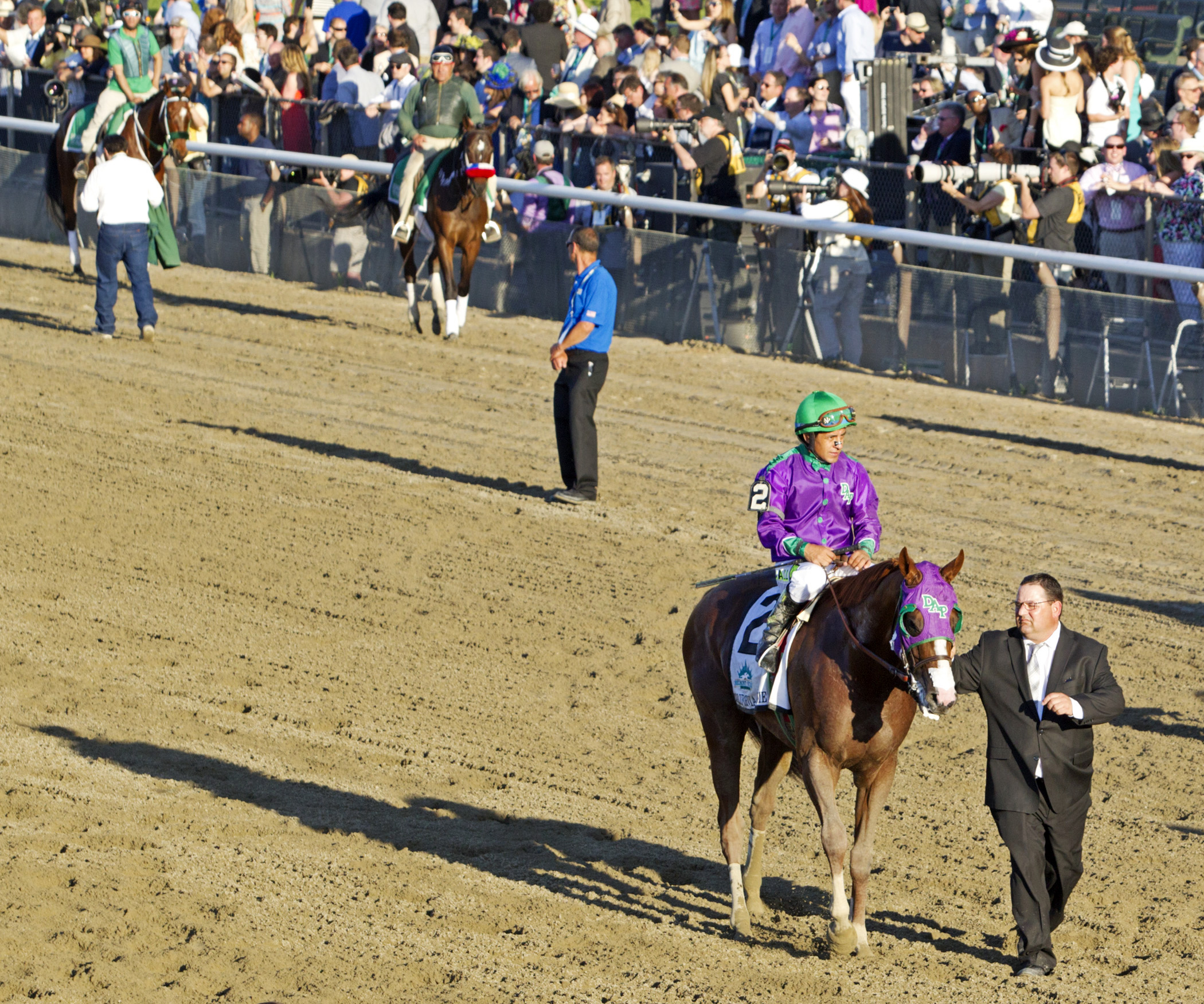 California Chrome with assistant trainer Alan Sherman after Belmont
