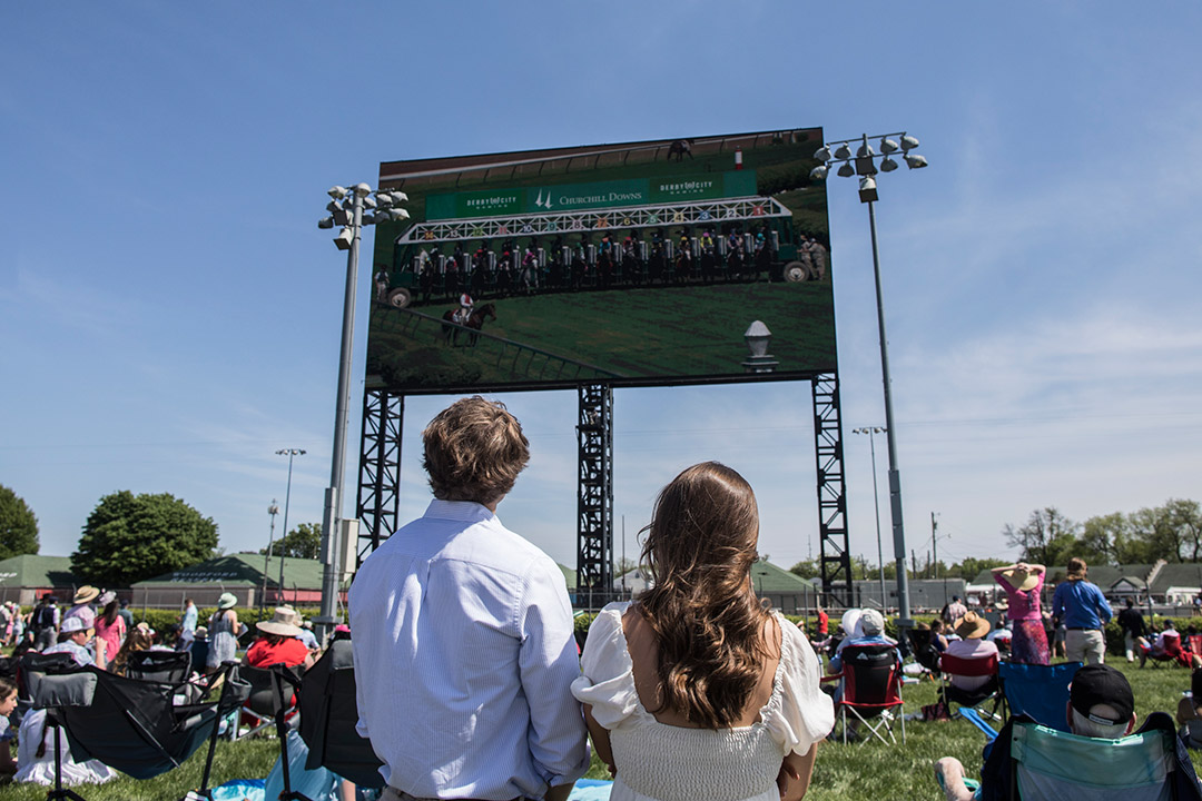 Fans watch the American Turf from the infield at Churchill Downs