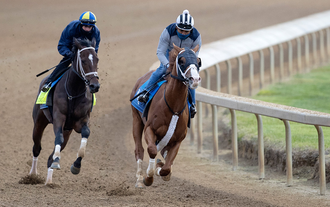 Warrant (right) trains with Caddo River at Churchill Downs in April 2021