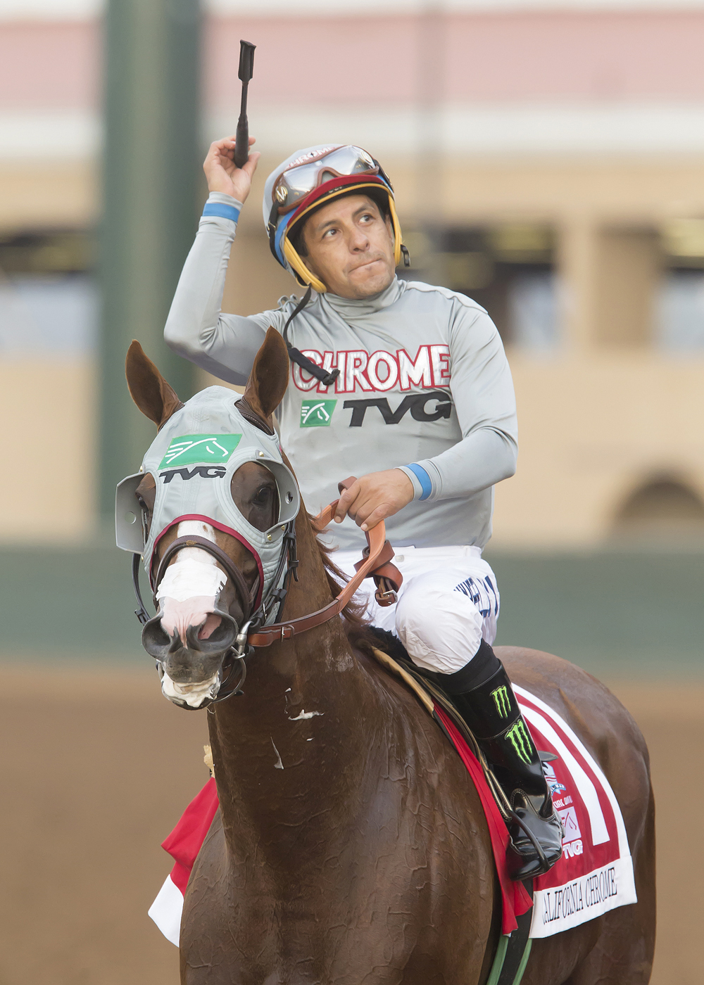 Victor Espinoza aboard California Chrome after winning the Pacific Classic