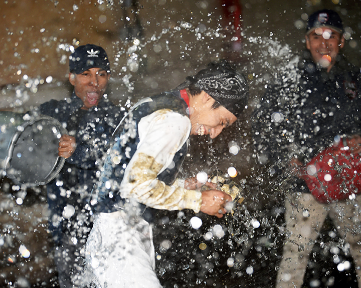Luis Cardenas gets doused with water after his first career win on Jan. 10, 2020