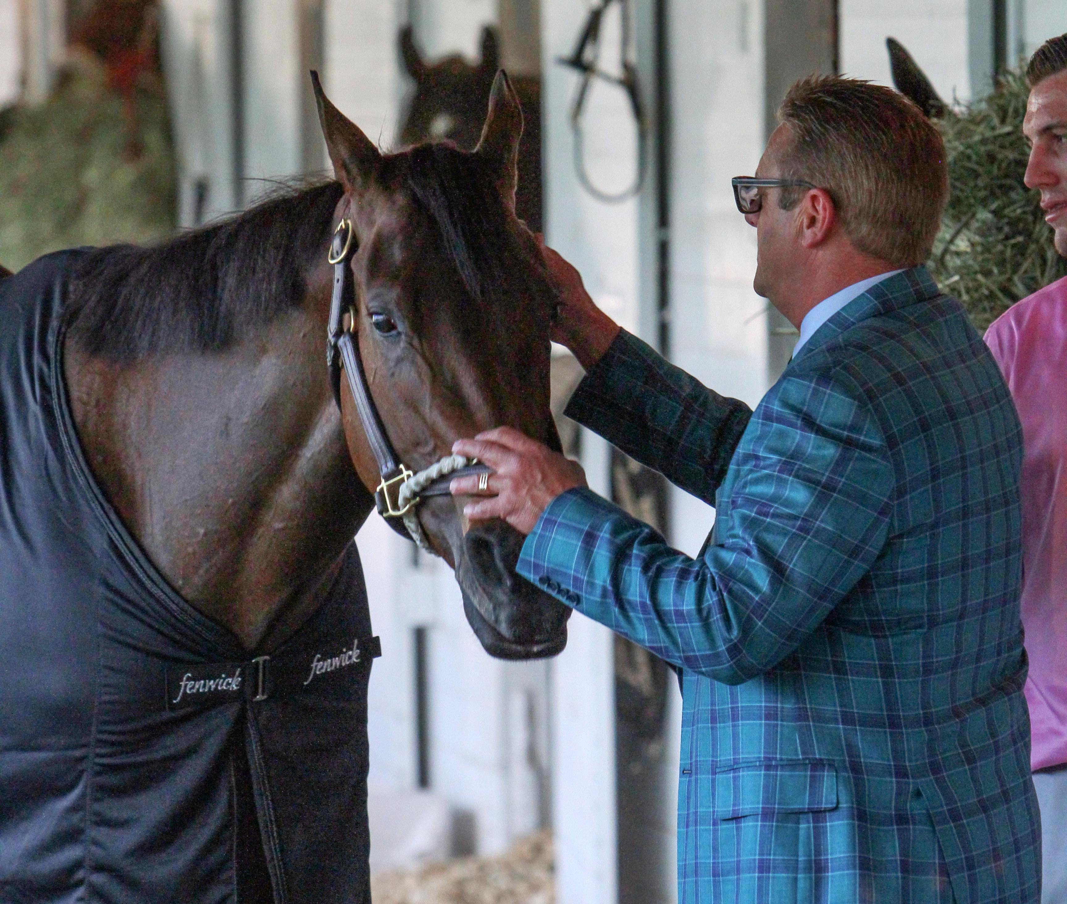Cathryn Sophia with trainer John Servis