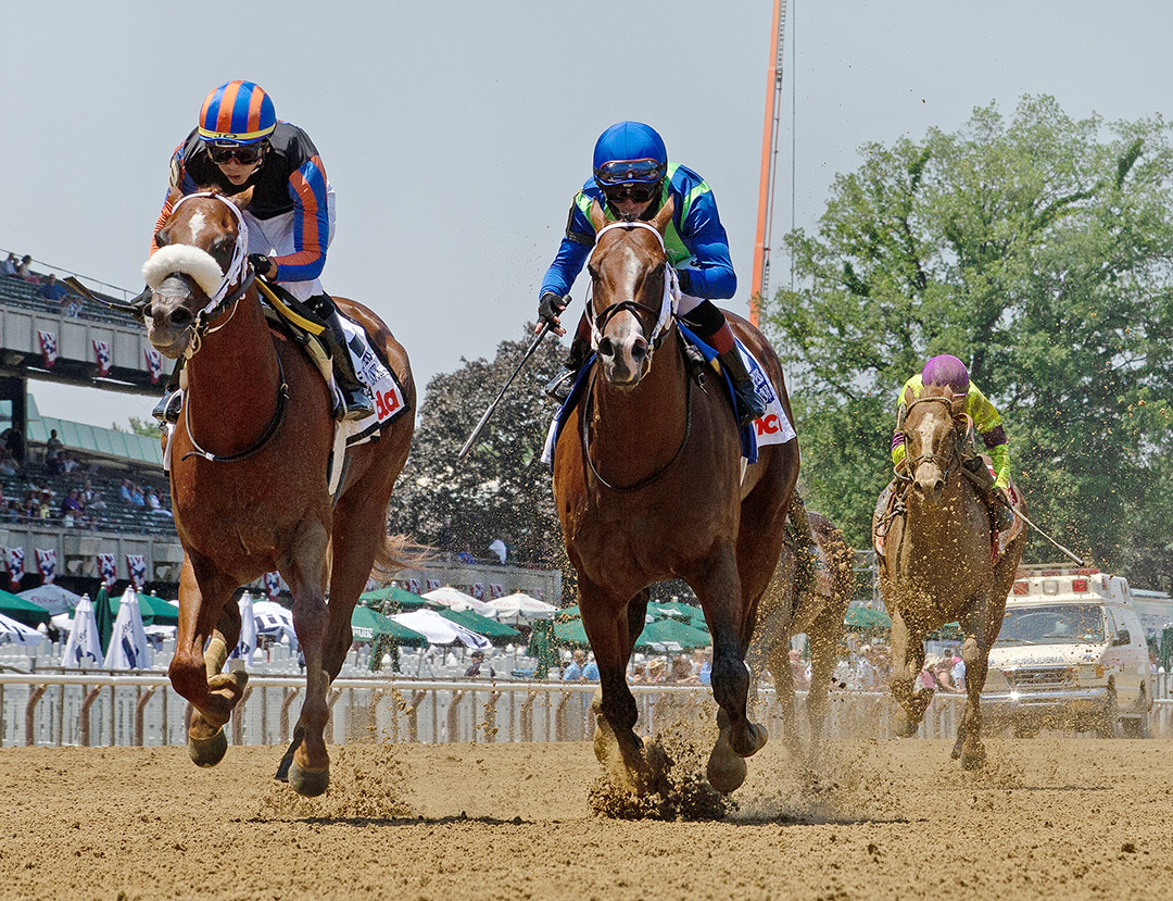 Drain the Clock, left, wins the 2021 Woody Stephens Stakes at Belmont Park