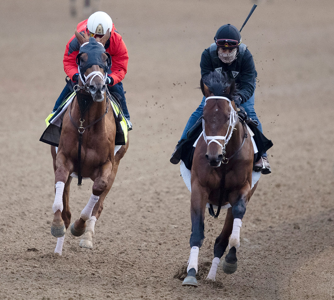 Prime Factor (right) trains with Dynamic One at Churchill Downs in April 2021