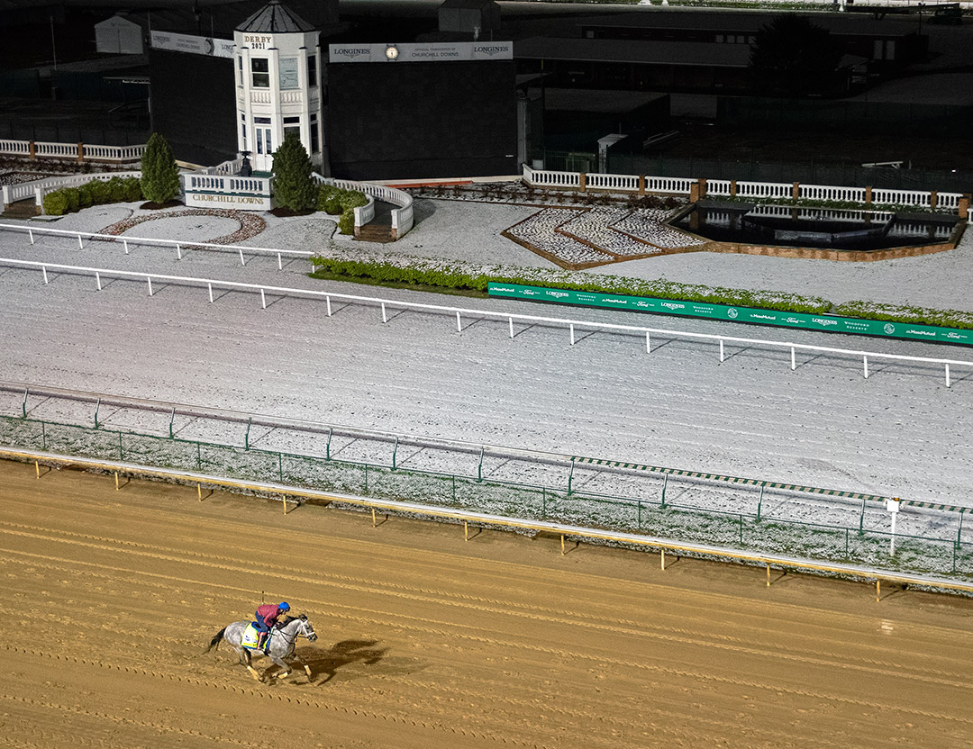 Essential Quality gallops at a snowy Churchill Downs on April 21