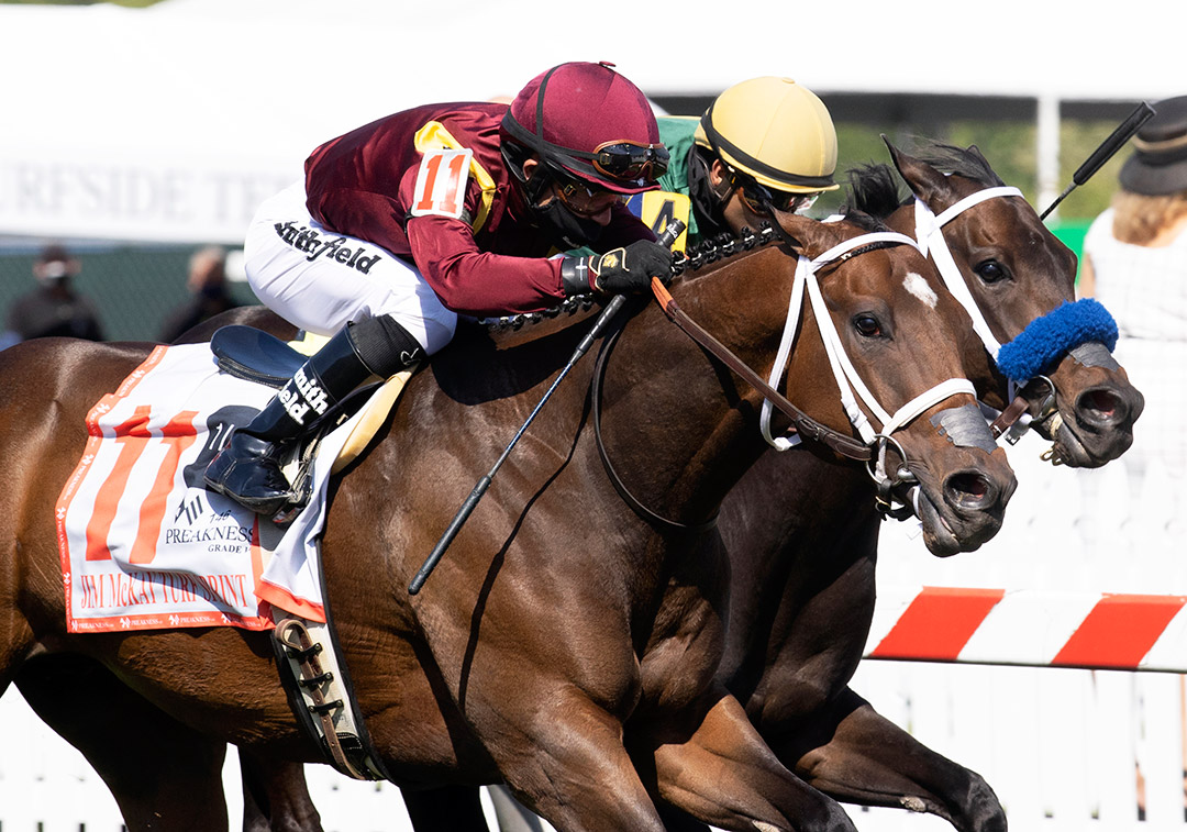 Firecrow (left) wins the 2021 Jim McKay Turf Sprint at Pimlico Race Course