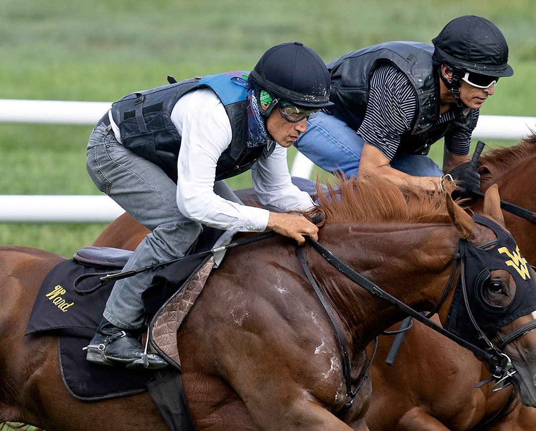 David Flores (left) and John Velazquez train horses at Saratoga on Aug. 13