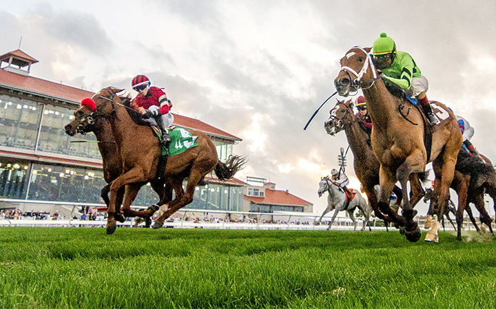 Hotshot Anna (red cap, left) wins the 2019 Richard Scherer Memorial Stakes at Fair Grounds