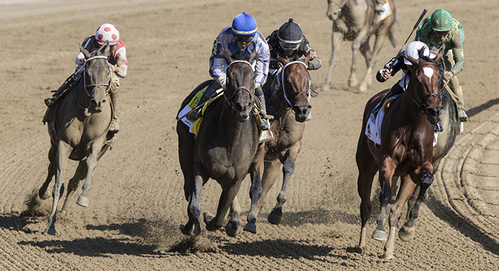 Midnight Bisou swings wide in the final turn of the Personal Ensign at Saratoga Race Course