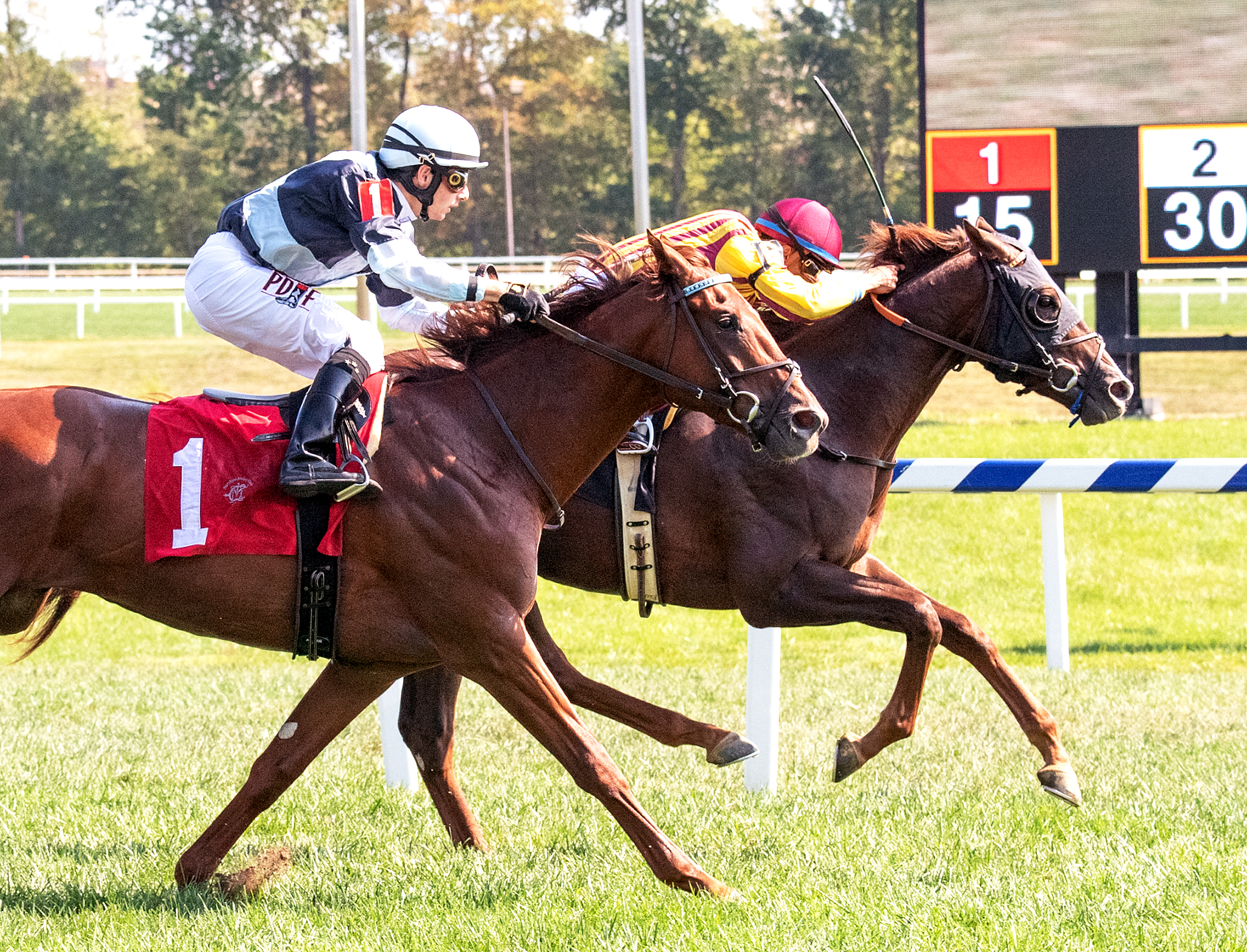 Irish Mias (inside) wins the Laurel Futurity at Laurel Park