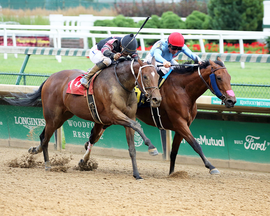 Jungle Juice (right) wins a June 24 allowance at Churchill Downs