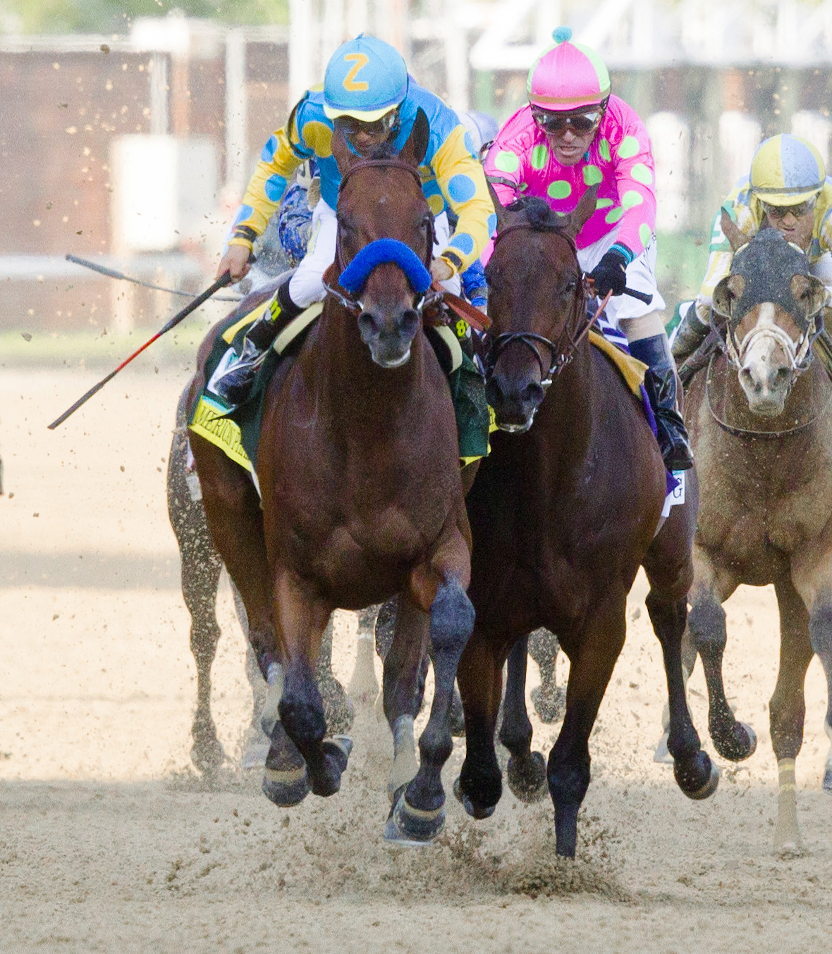 Victor Espinoza uses the whip on American Pharoah