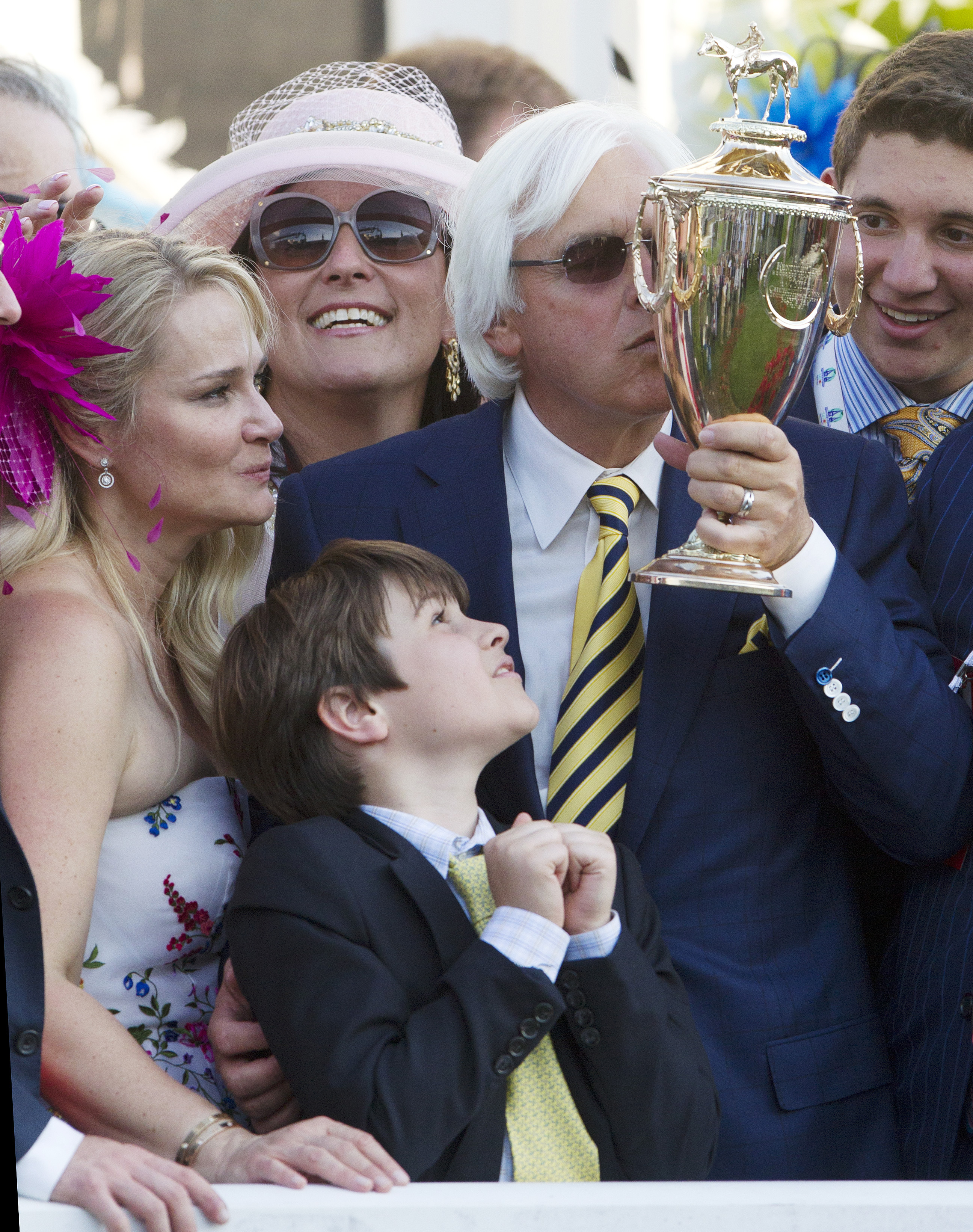Bob Baffert kisses the trophy after the Kentucky Derby