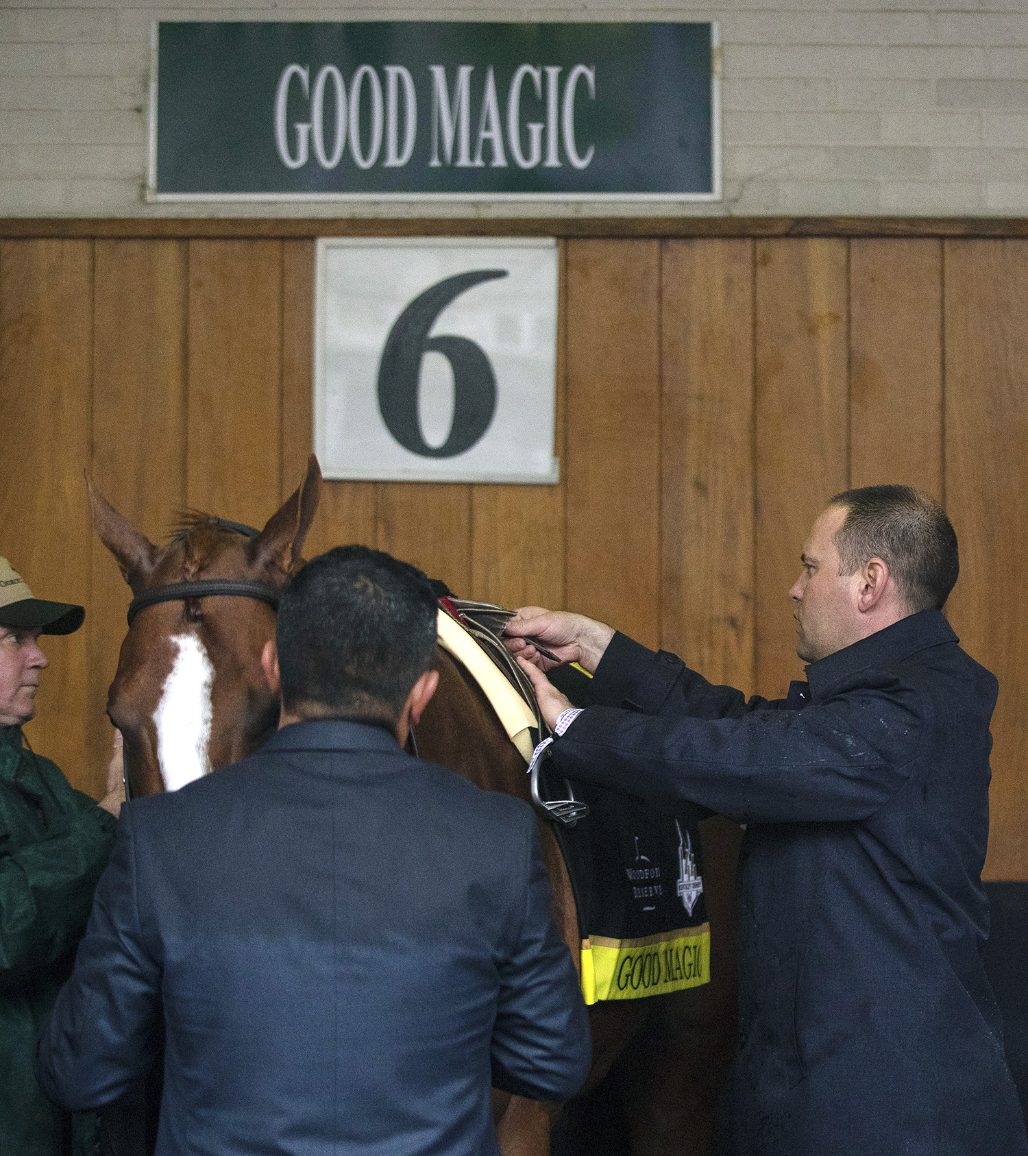 Chad Brown saddles Good Magic before the Kentucky Derby