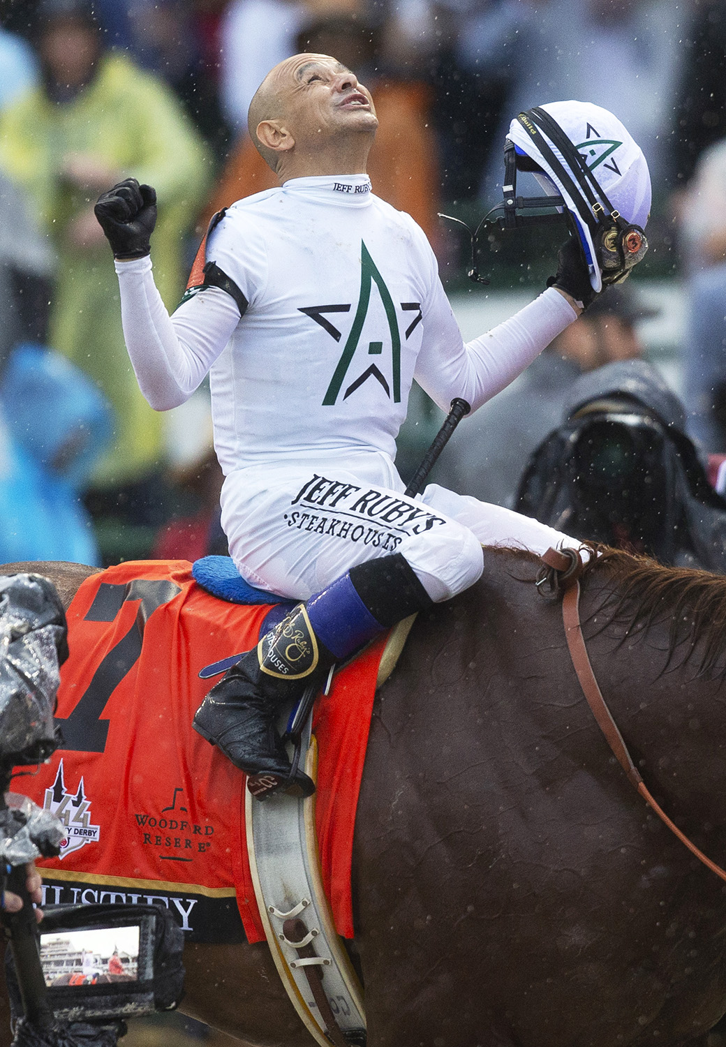 Mike Smith celebrates after the Kentucky Derby