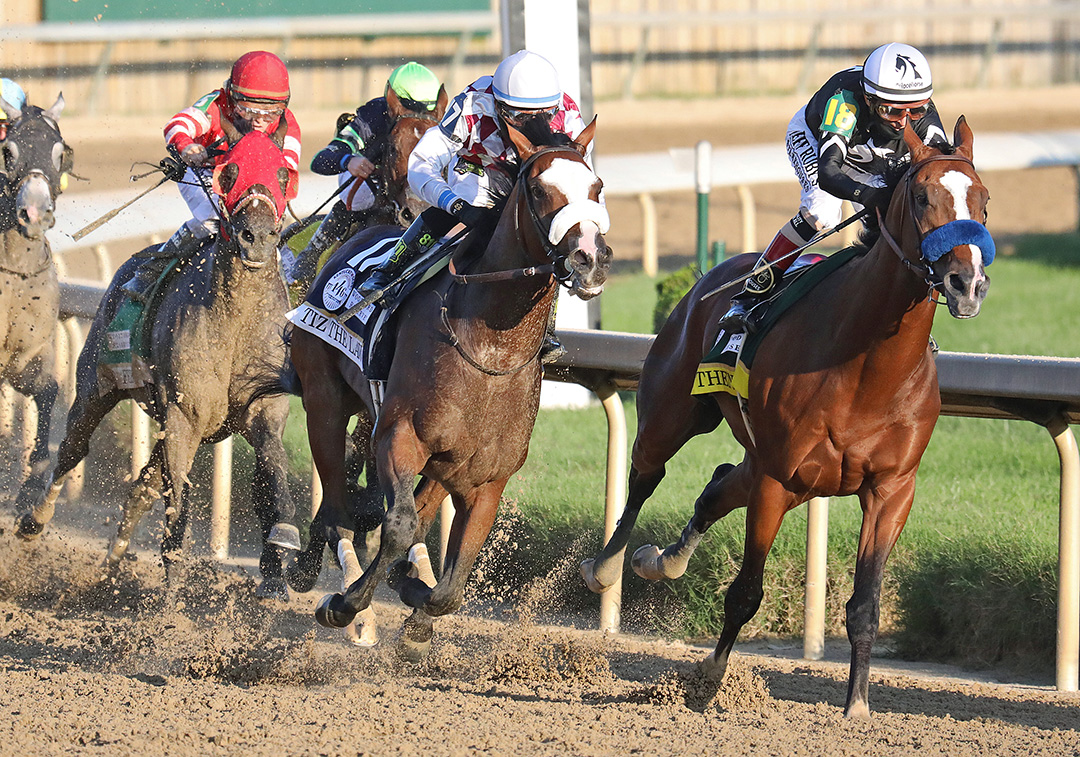 Tiz the Law (left) and Authentic exit the final turn of the Kentucky Derby at Churchill Downs