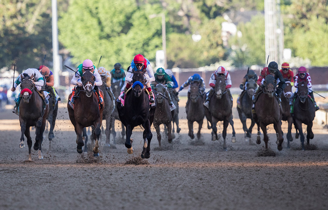 Medina Spirit (red cap) wins the 2021 Kentucky Derby at Churchill Downs