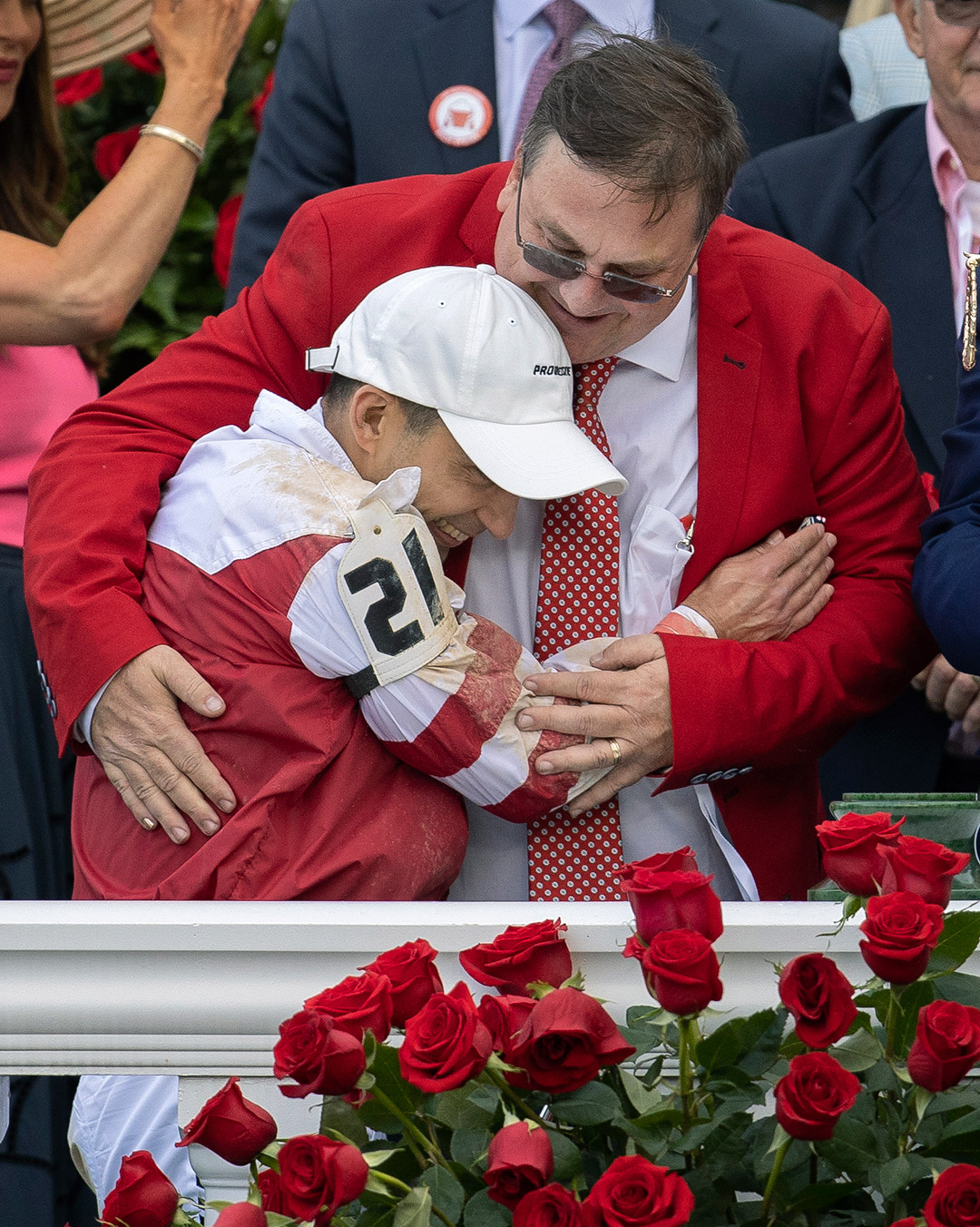 Trainer Eric Reed and jockey Sonny Leon hug after the Kentucky Derby