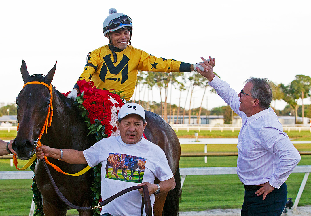 Juan Avila congratulates Samy Camacho after King Guillermo won the Tampa Bay Derby at Tampa Bay Downs