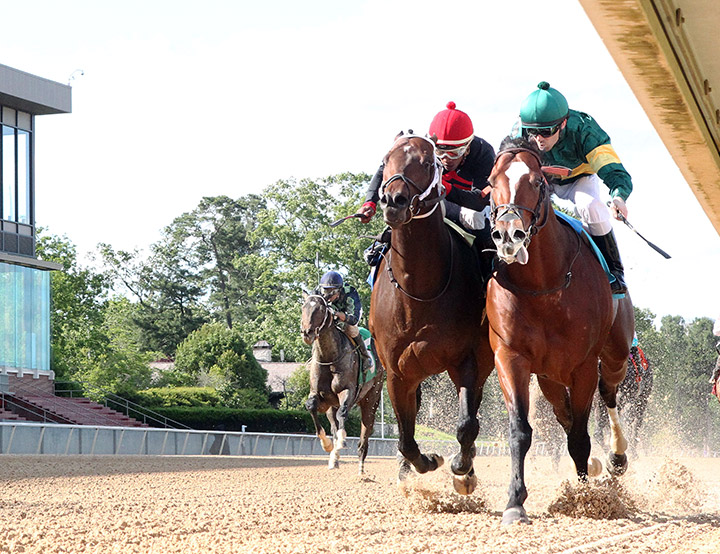 Long Weekend (right) wins the Bachelor Stakes at Oaklawn Park