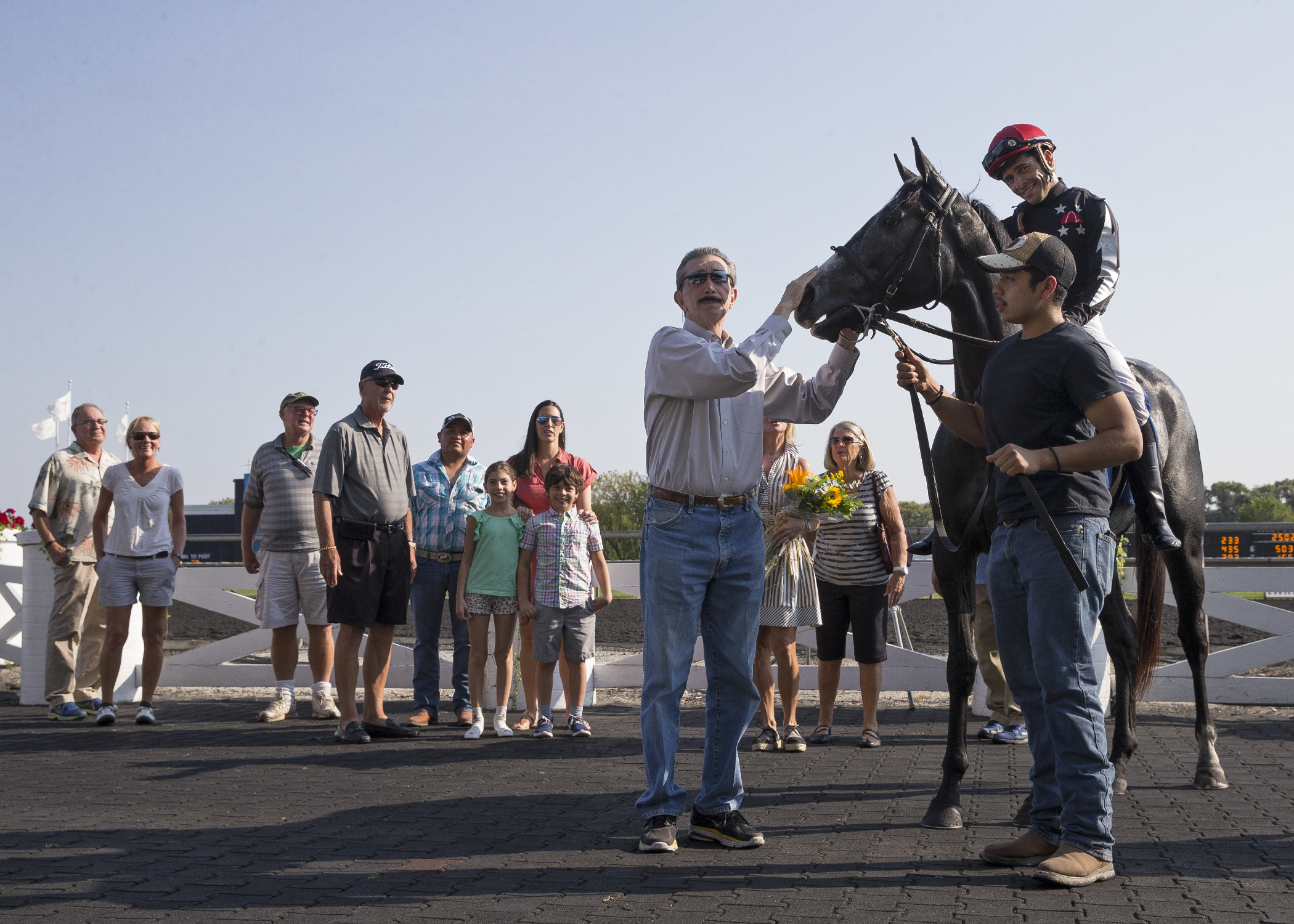 Trainer Louie Roussel III with his 1000th winner, Heavens Whisper