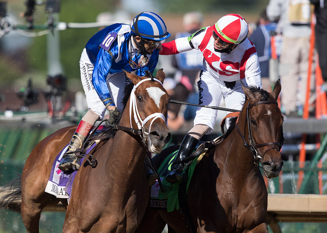 Malathaat jockey John Velazquez (left) gets congratulated after winning the 2021 Kentucky Oaks at Churchill Downs