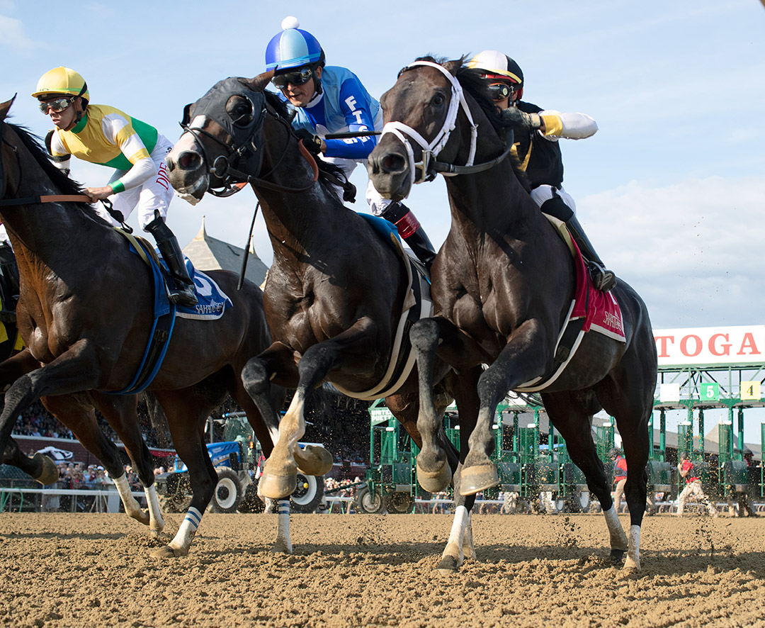 Masqueparade (blue silks) and Dr Jack (right) break at the start of the Jim Dandy Stakes
