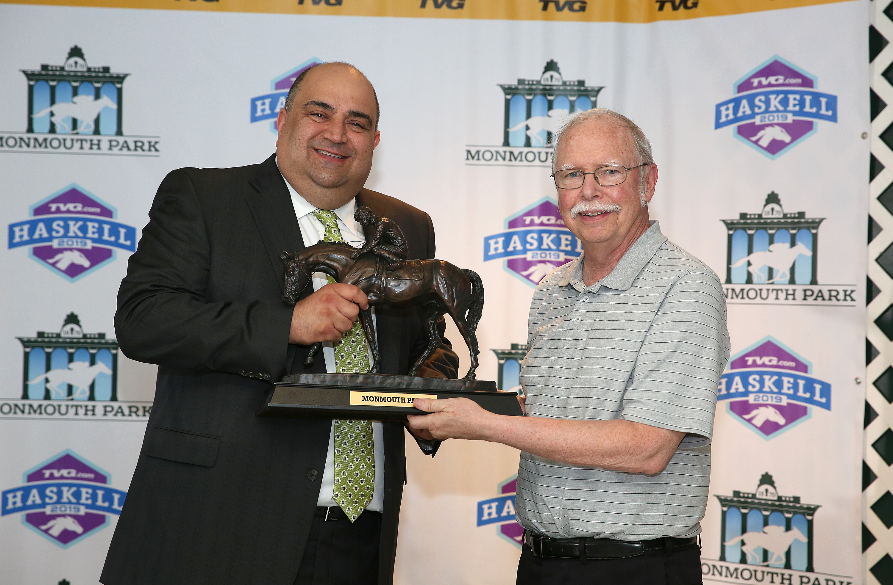 Mike Farrell (right) receives Bill Handleman Award from Frank Mirahmadi