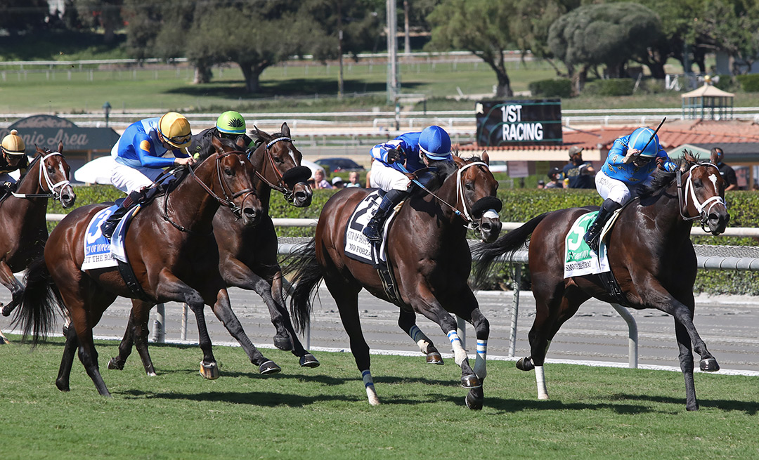 Mo Forza (center) leads Hit the Road (left) and Smooth Like Strait (right) in the City of Hope Mile at Santa Anita