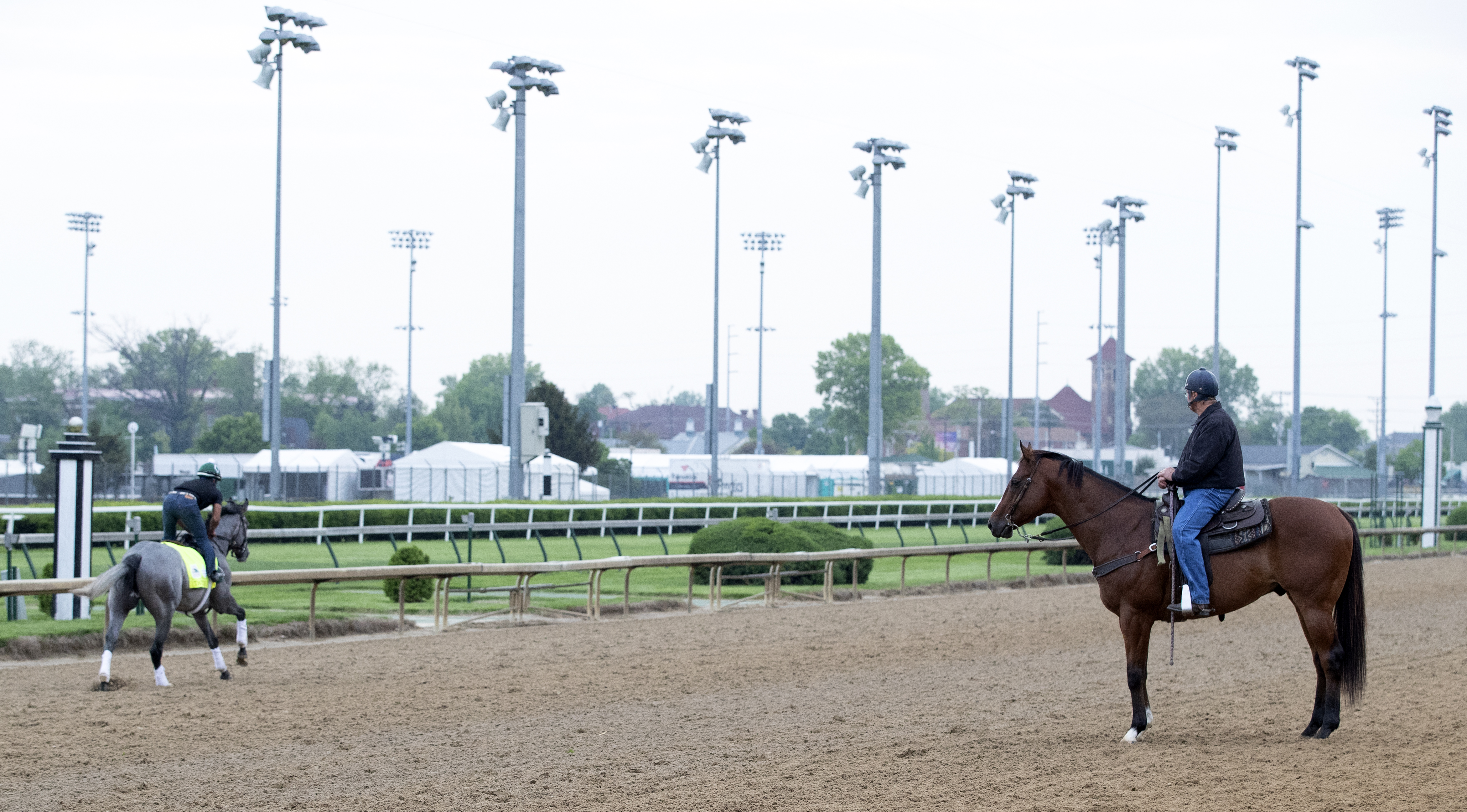 Bill Mott (on pony) watches Tacitus train at Churchill Downs on 4.30.19
