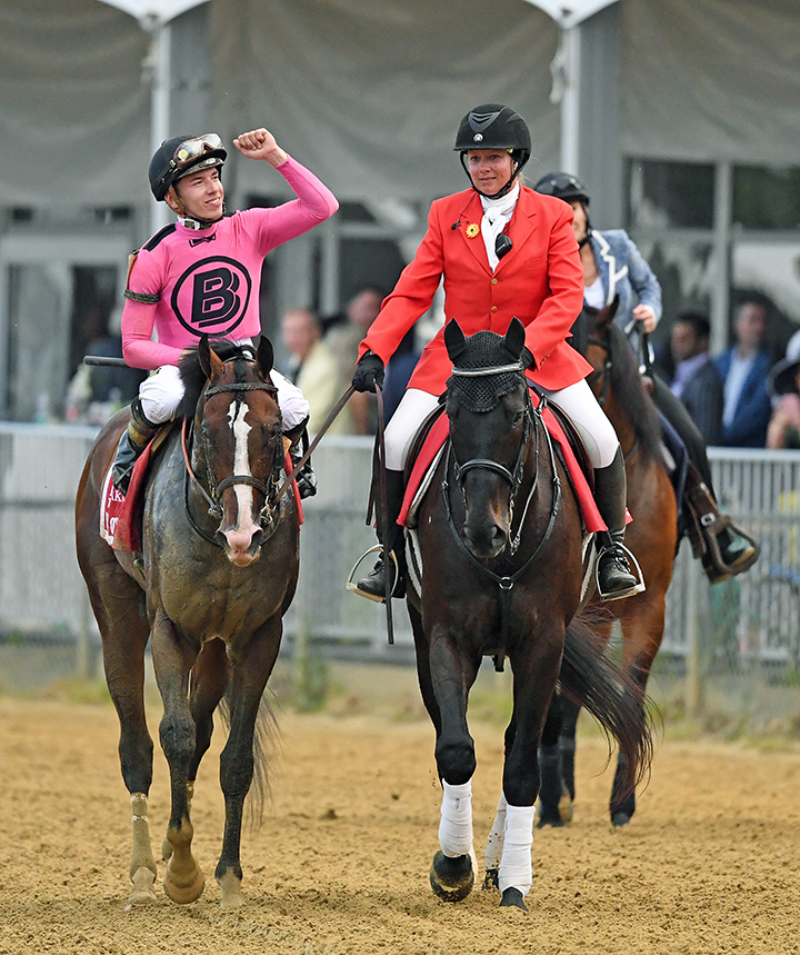 Tyler Gaffalione celebrates after winning the Preakness with War of Will