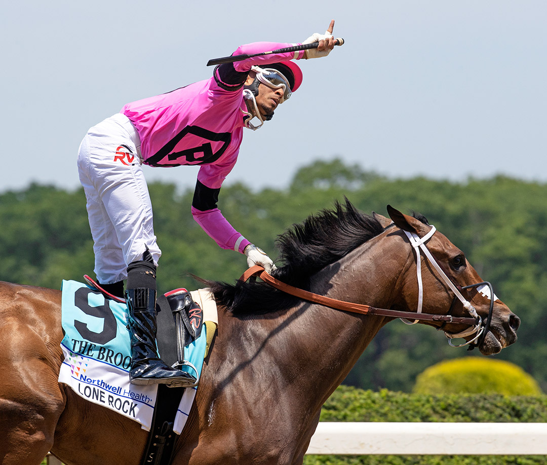 Ramon Vazquez celebrates after winning the Brooklyn Stakes with Lone Rock at Belmont Park