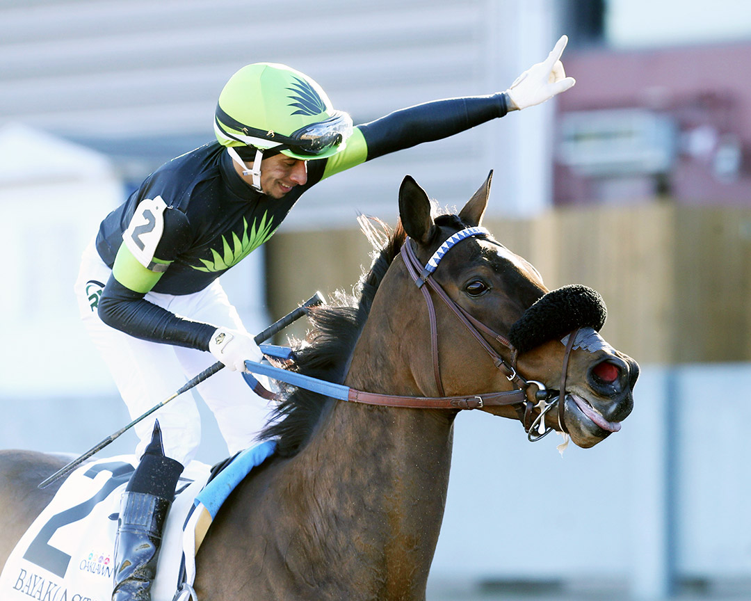 Ramon Vazquez celebrates after winning the Bayakoa aboard Miss Bigly