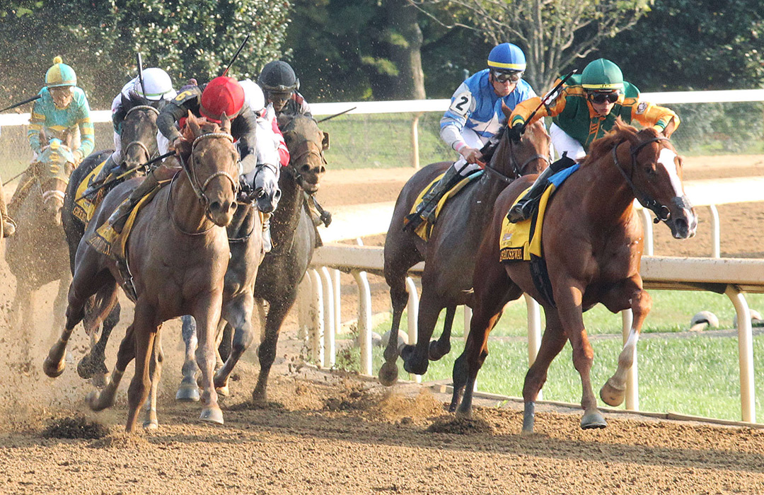 Rattle N Roll (left) and Classic Causeway (right) head into the stretch of the Breeders' Futurity at Keeneland