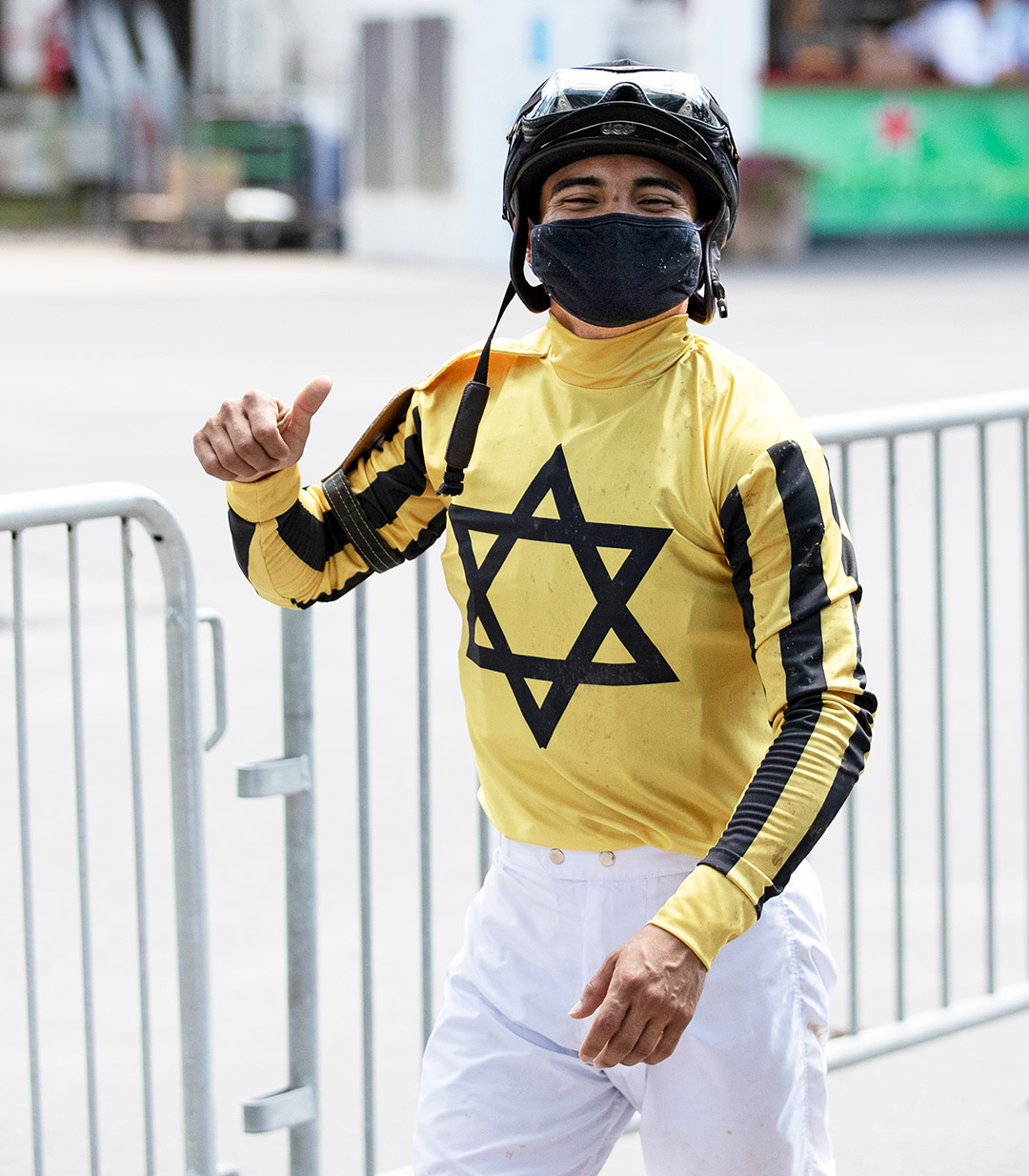 Luis Saez smiles under his mask returning to Saratoga on July 24
