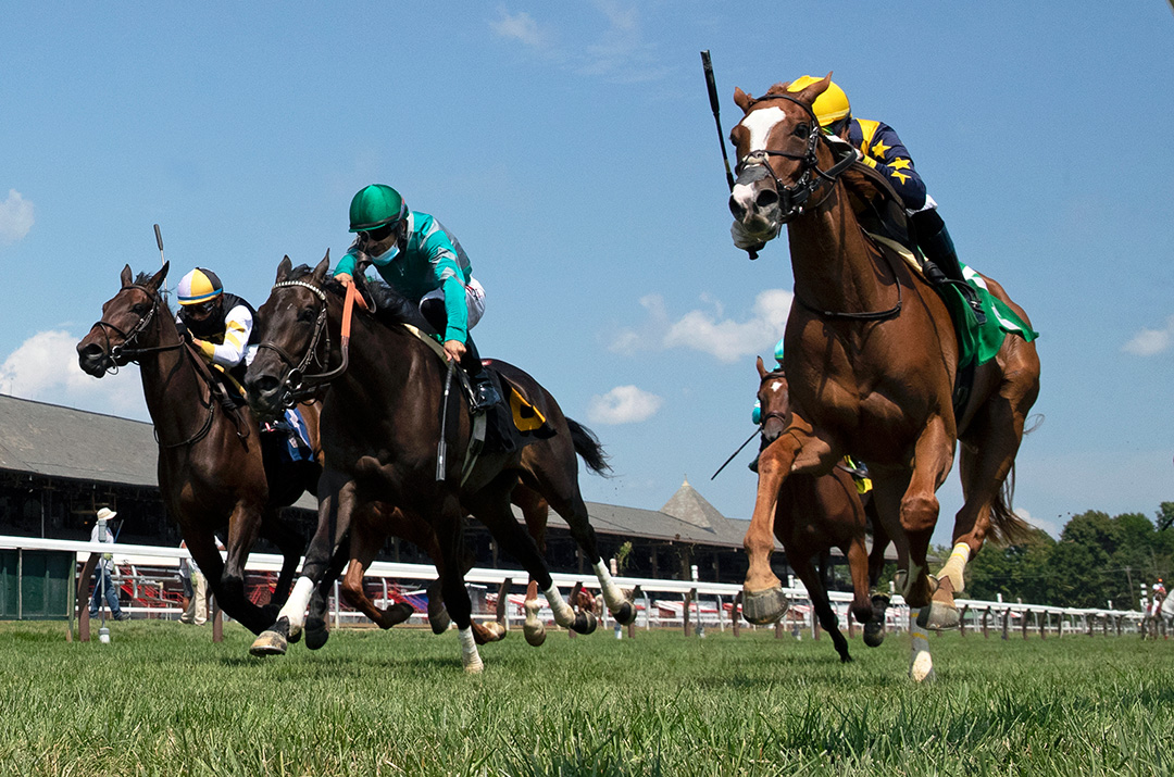 Seasons (right) wins an Aug. 9 maiden race at Saratoga Race Course
