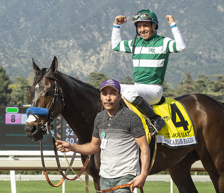 Victor Espinoza aboard St. Joe Bay after the San Carlos Stakes