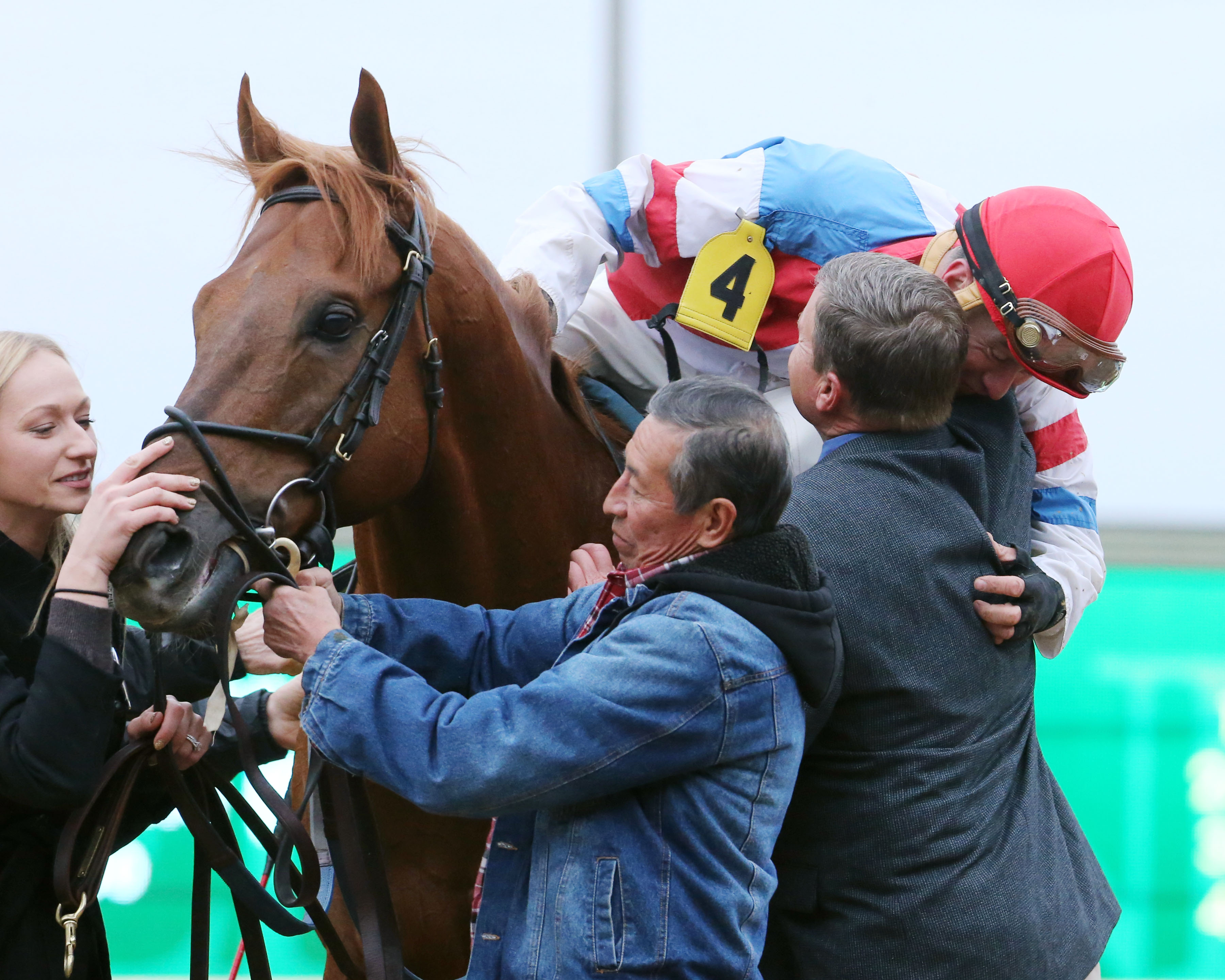 The Player-Calvin Borel hugs Buff Bradley following The Players win in the 2017 Fayette Stakes