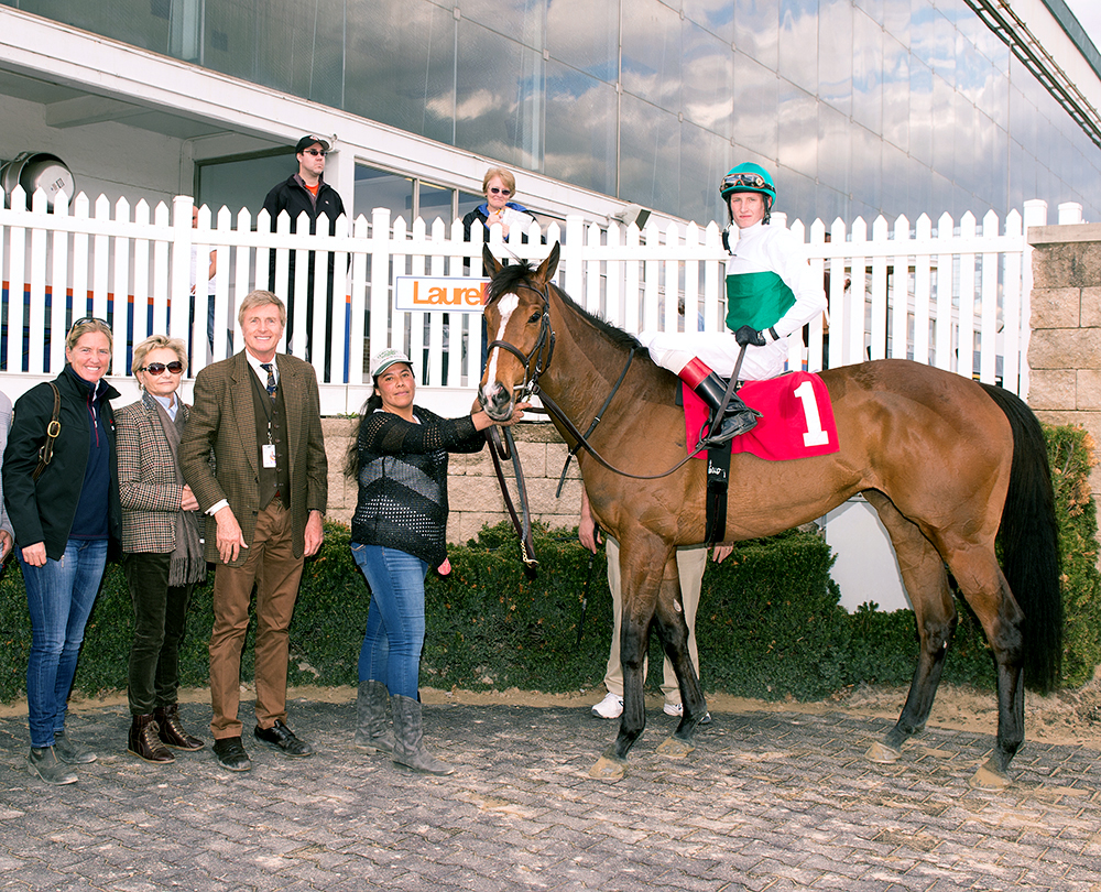 Tide Is High in the winner's circle with Michael Dickinson