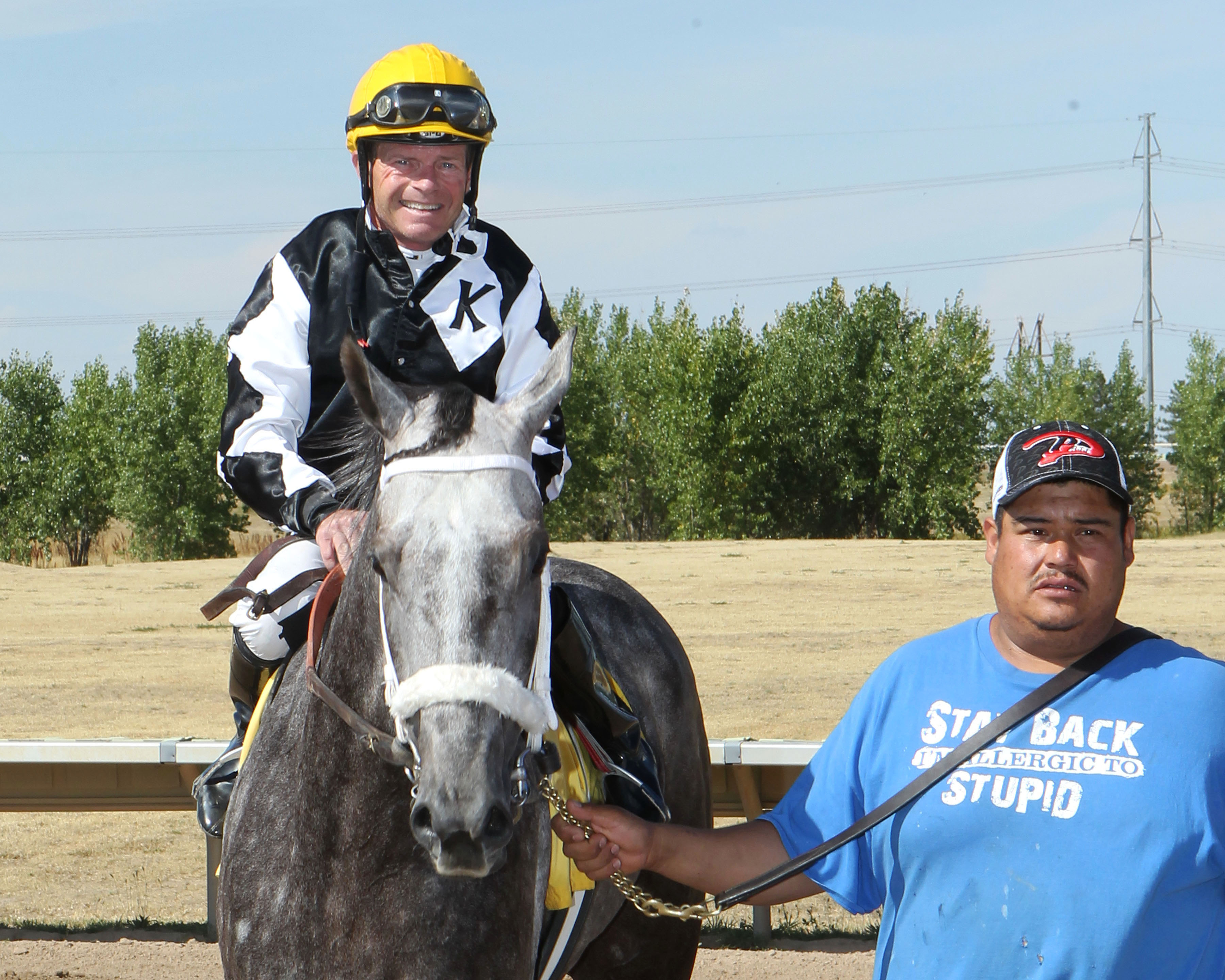 Jockey Dennis Collins aboard Z Smoking Gun after winning the Need for Speed Stakes