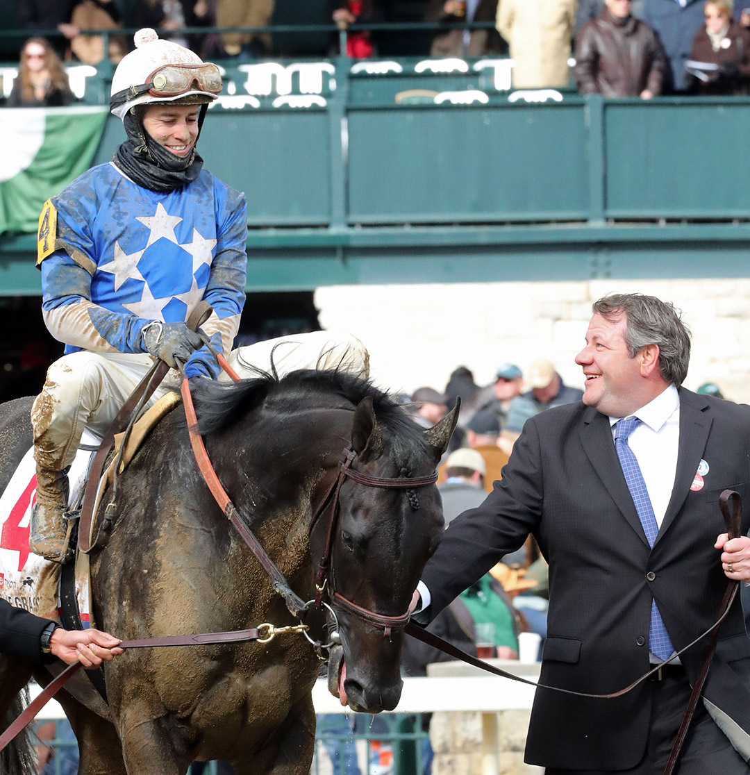Flavien Prat aboard Zandon with owner Jeff Drown (right) at the Blue Grass Stakes